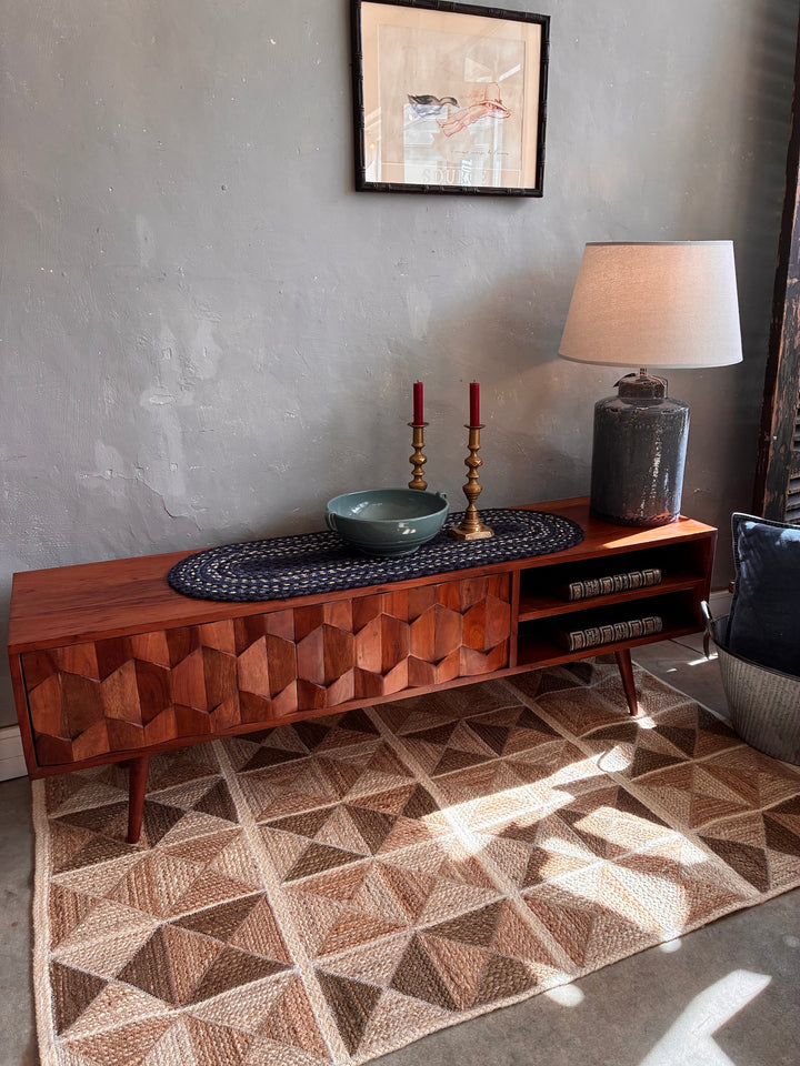 Retro Swoon Editions TV Stand with tessellated wood doors, decorative vase, and lamp in a stylish living room setting.