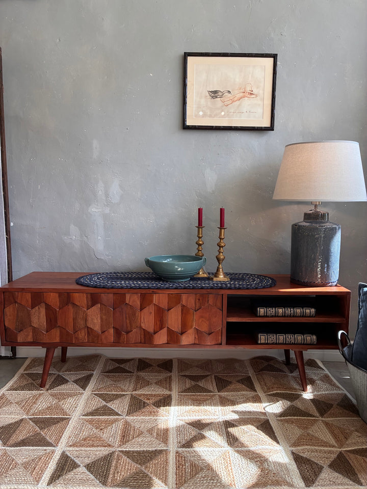 Retro Swoon Editions TV Stand with tessellated wood tiles, lamp, and decor in a stylish living room.