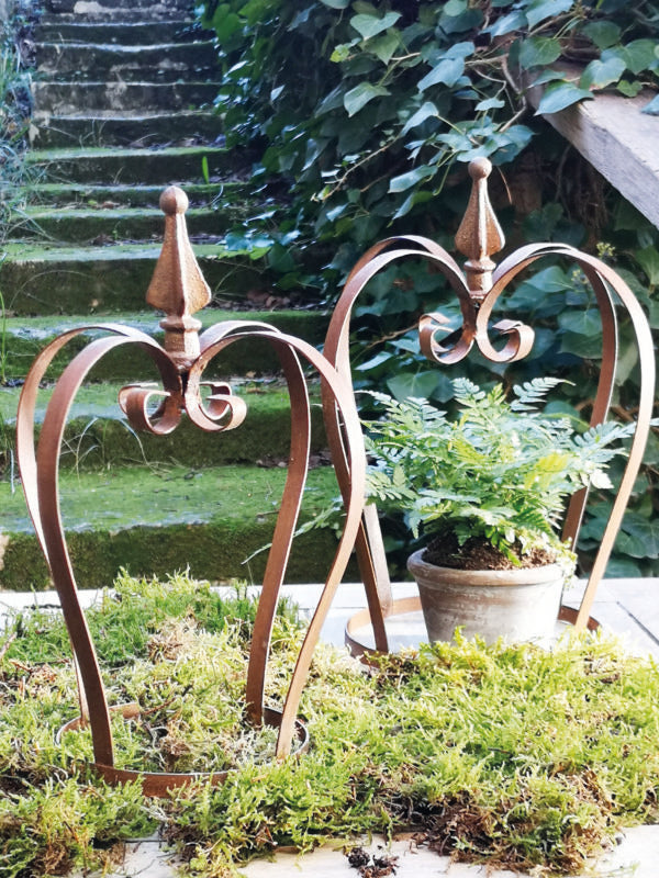 two rusty crown garden ornaments