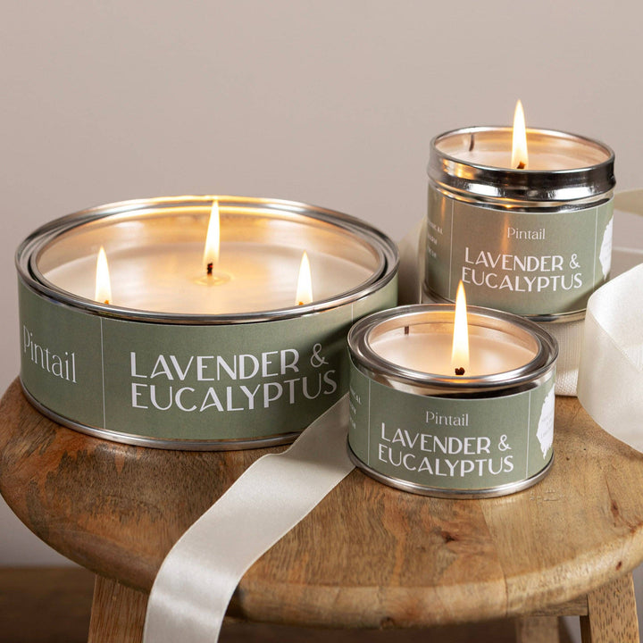 Pintail Candles - Lavender & Eucalyptus Classic Tin displayed on a wooden surface, featuring both large and small tins.