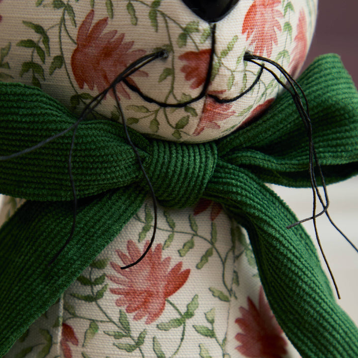 Hattie Hare Door Stop - Floral Design featuring a handpainted floral pattern and green bow for charming decor.