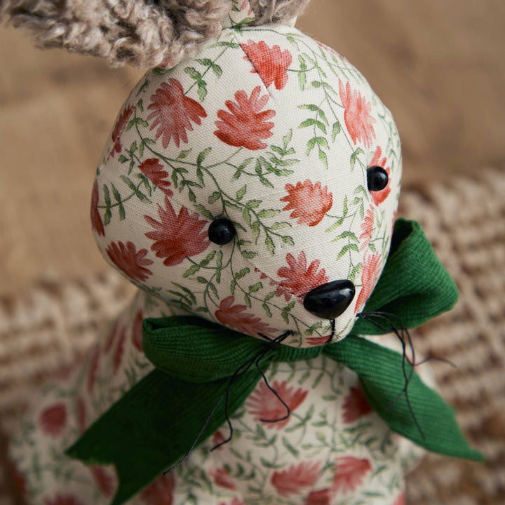 Hattie Hare Door Stop - Floral Design featuring a handpainted floral pattern and green bow, adding charm to any room.