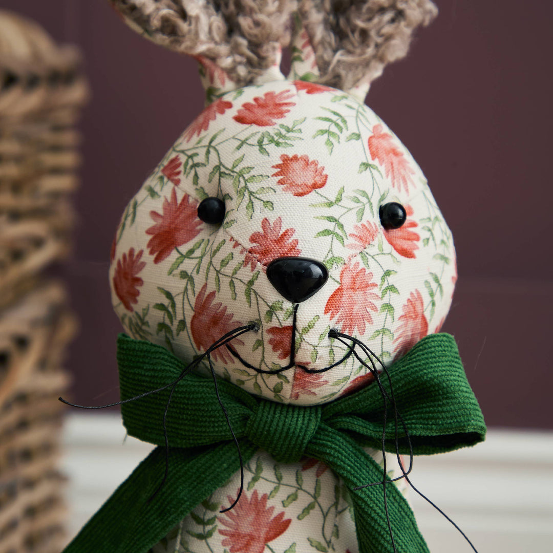 Hattie Hare Door Stop - Floral Design with handpainted floral patterns and a green bow, perfect for home decor.