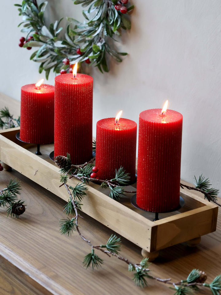 4 red candles with subtle glitter and grooves at Source for the Goose, Devon