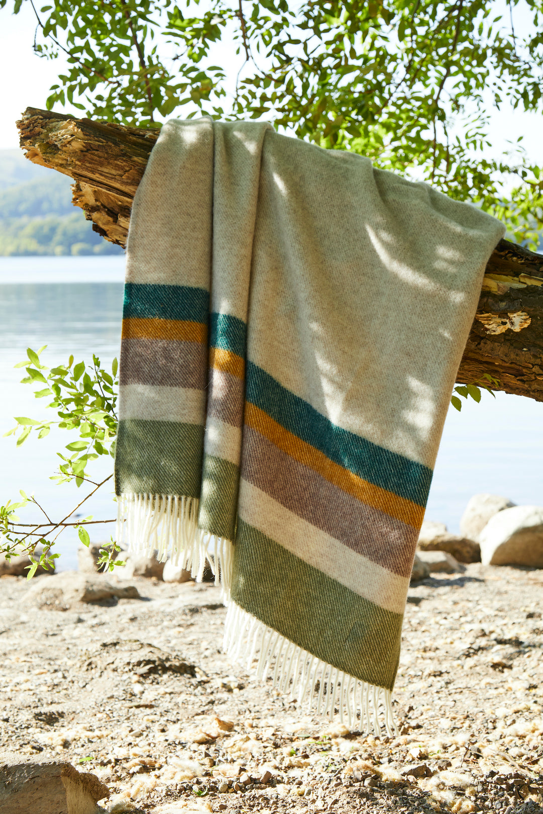 Tweedmill Alaska Earthy Wool Blanket hanging from a tree