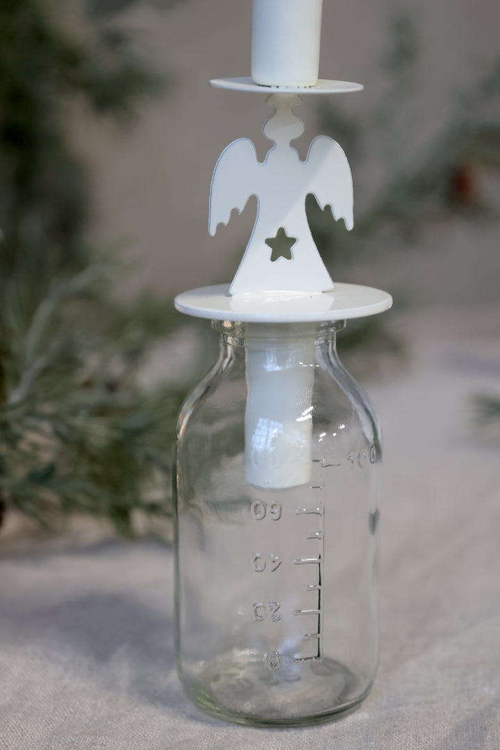 Angel Design Bottle Candle Holder from Source for the Goose Devon, featuring a delicate angel atop a glass base.