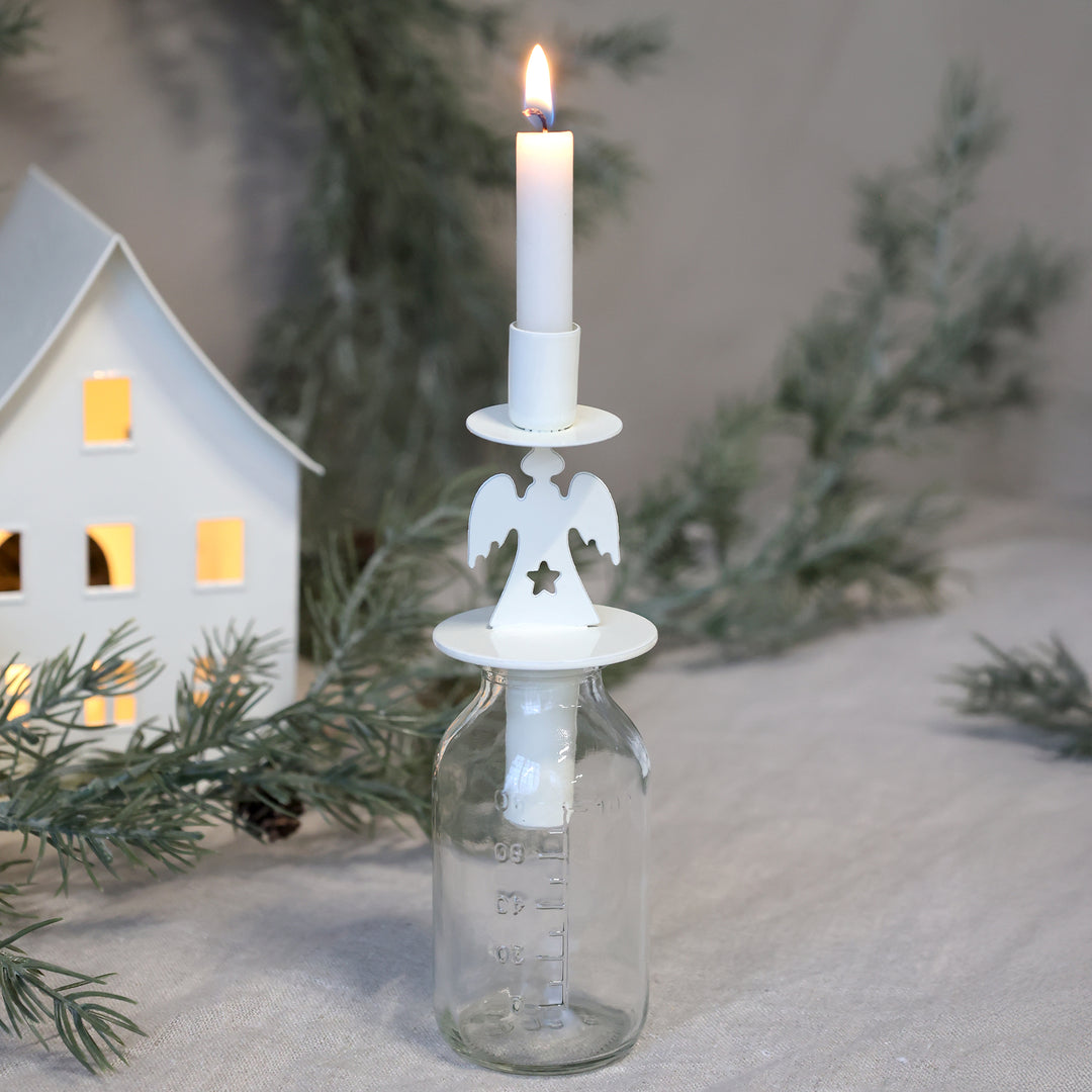 Angel Design Bottle Candle Holder by Source for the Goose Devon, featuring delicate cream metal and festive ambiance.