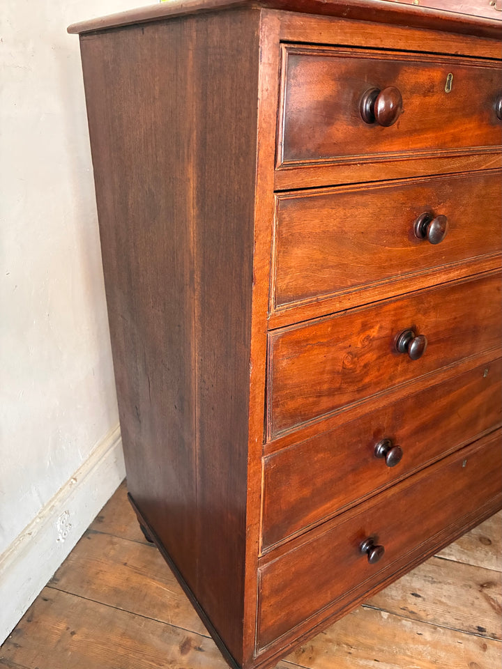 Tall Antique Mahogany Chest of Drawers showcasing traditional design and craftsmanship, perfect for versatile storage.