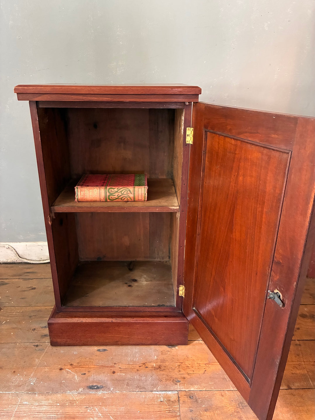 Antique Mahogany Bedside Cabinet with open door showing one shelf and vintage books inside, perfect for traditional decor.
