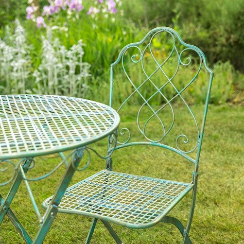 Avalon Garden Bistro Set featuring vintage-style lattice seats and ornamental swirls in antique green color.