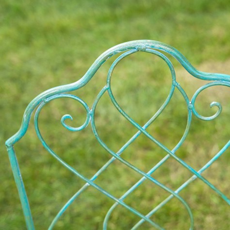 Close-up of the ornamental swirls on the Avalon Garden Bistro Set chair in antique green, perfect for outdoor elegance.