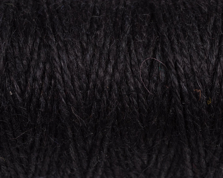 Nutscene Jute Twine on Hanging Recycled Lancashire Mill Bobbin close-up showing rich black color and texture.