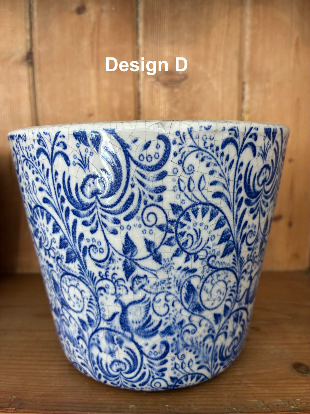 Handcrafted blue and white Dutch-style flowerpot with vintage design, perfect for adding charm to any decor.