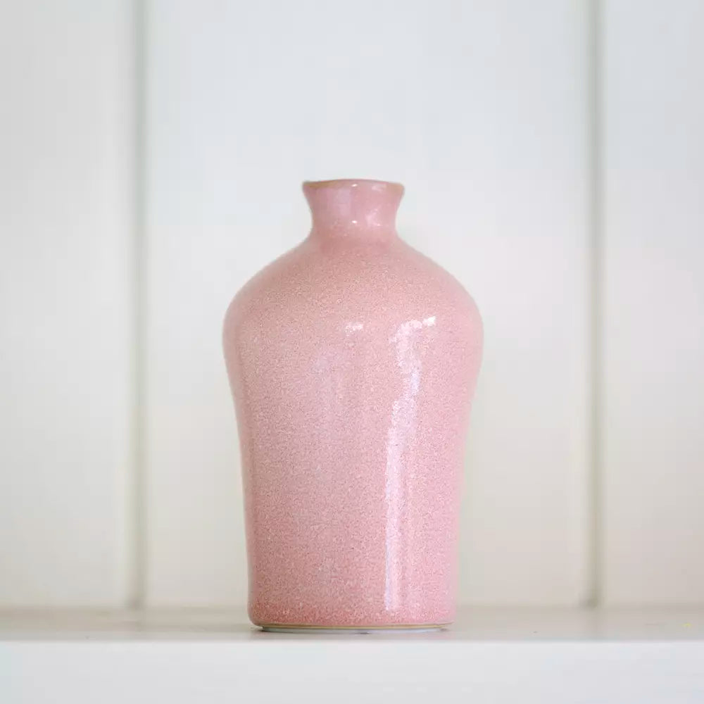 Small Blush Pink Bud Vase from Source for the Goose Devon on a white shelf.