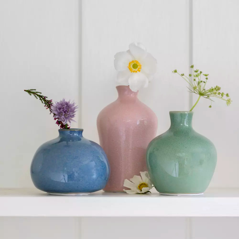 Small Blush Pink Bud Vase among colorful ceramic vases with flowers, ideal for home decor from Source for the Goose Devon.