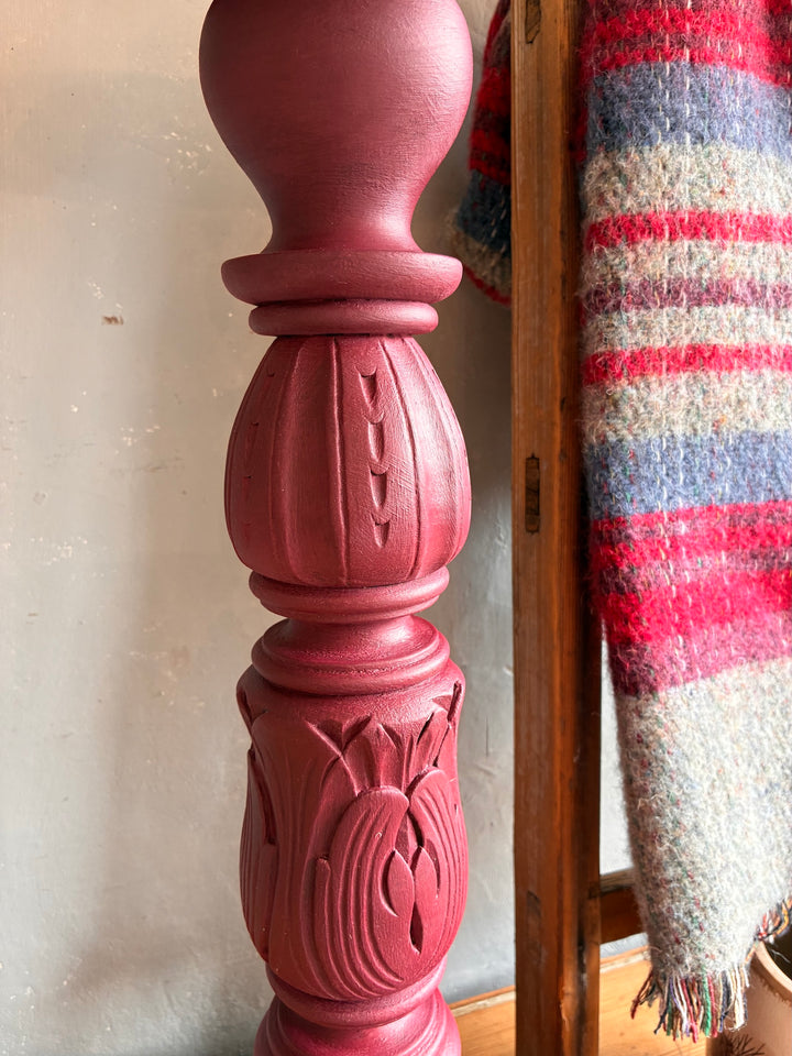 Close-up of the intricately carved design on the Vintage Wooden Burgundy Plant Stand by Source for the Goose Devon.