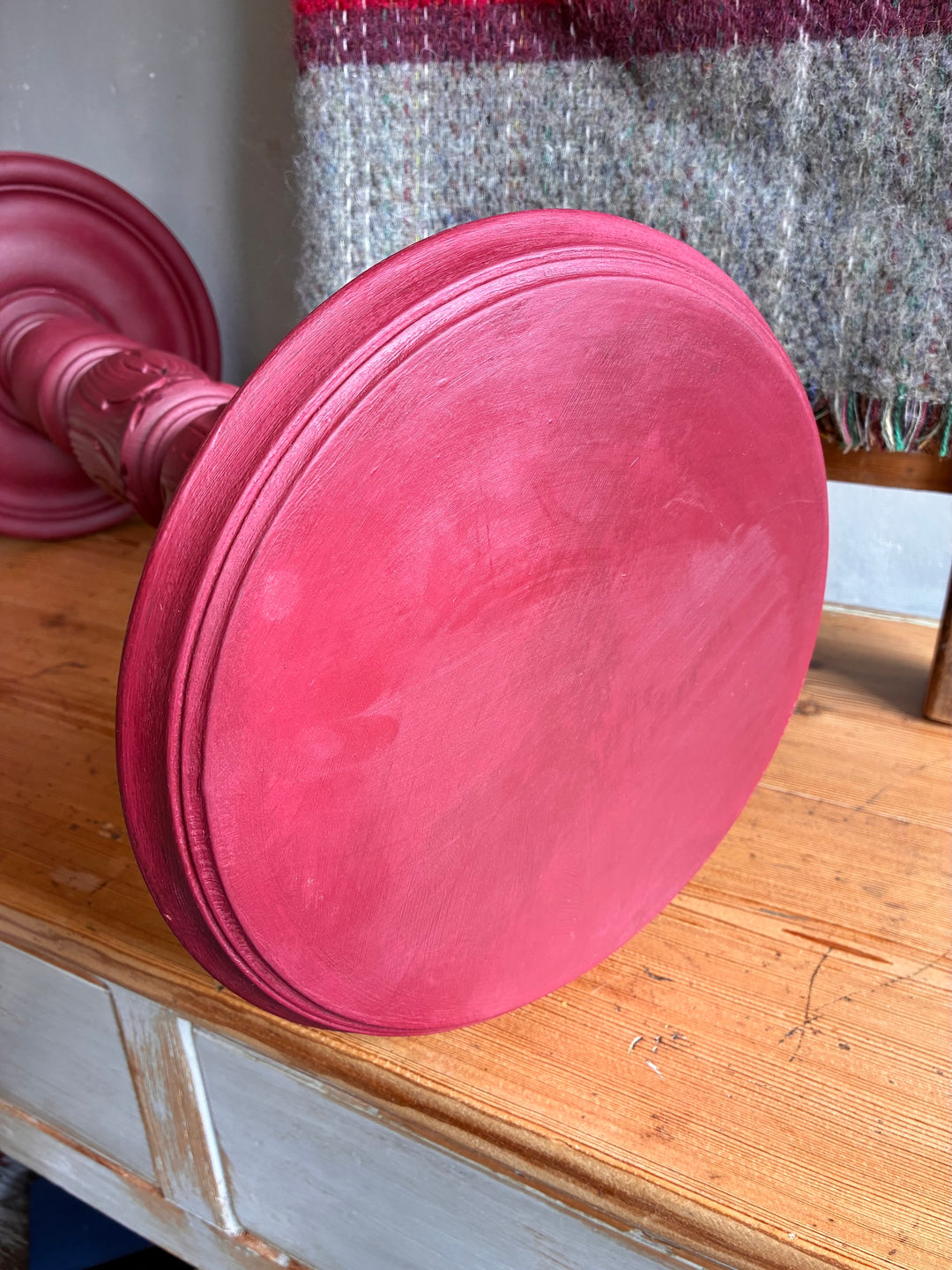 Vintage Wooden Burgundy Plant Stand with a round tabletop showing a hand-painted finish.