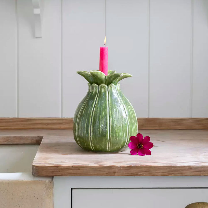 Charming Green Candle Holder and Vase Duo with pink candle and flower on wooden surface.