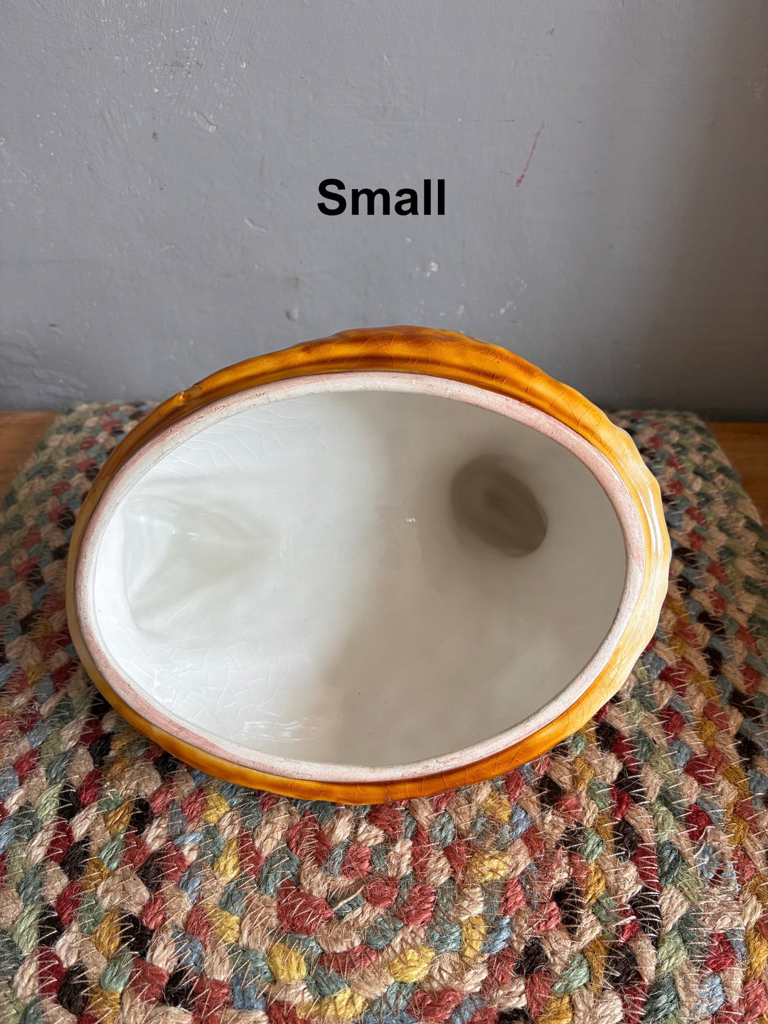 Small Chicken Egg Holder - Portugese Ceramic showcasing vibrant orange and white interior craftsmanship.
