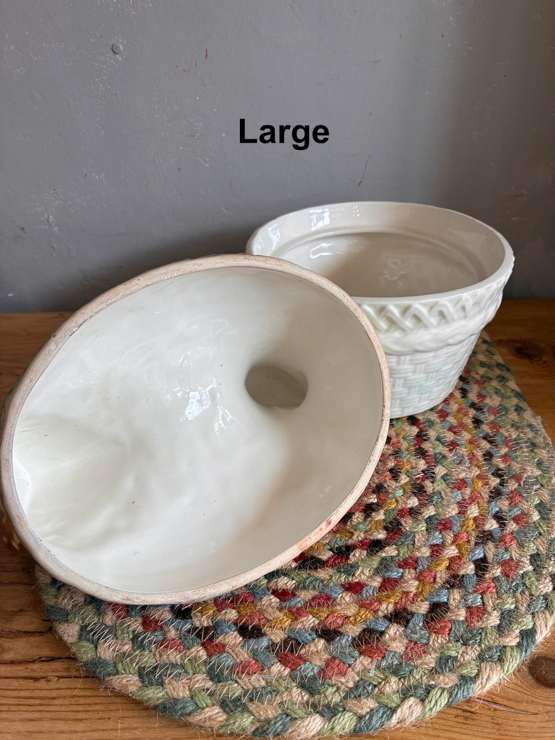 Chicken Egg Holder - Portugese Ceramic shown with its cream ceramic basket and a decorative woven mat.
