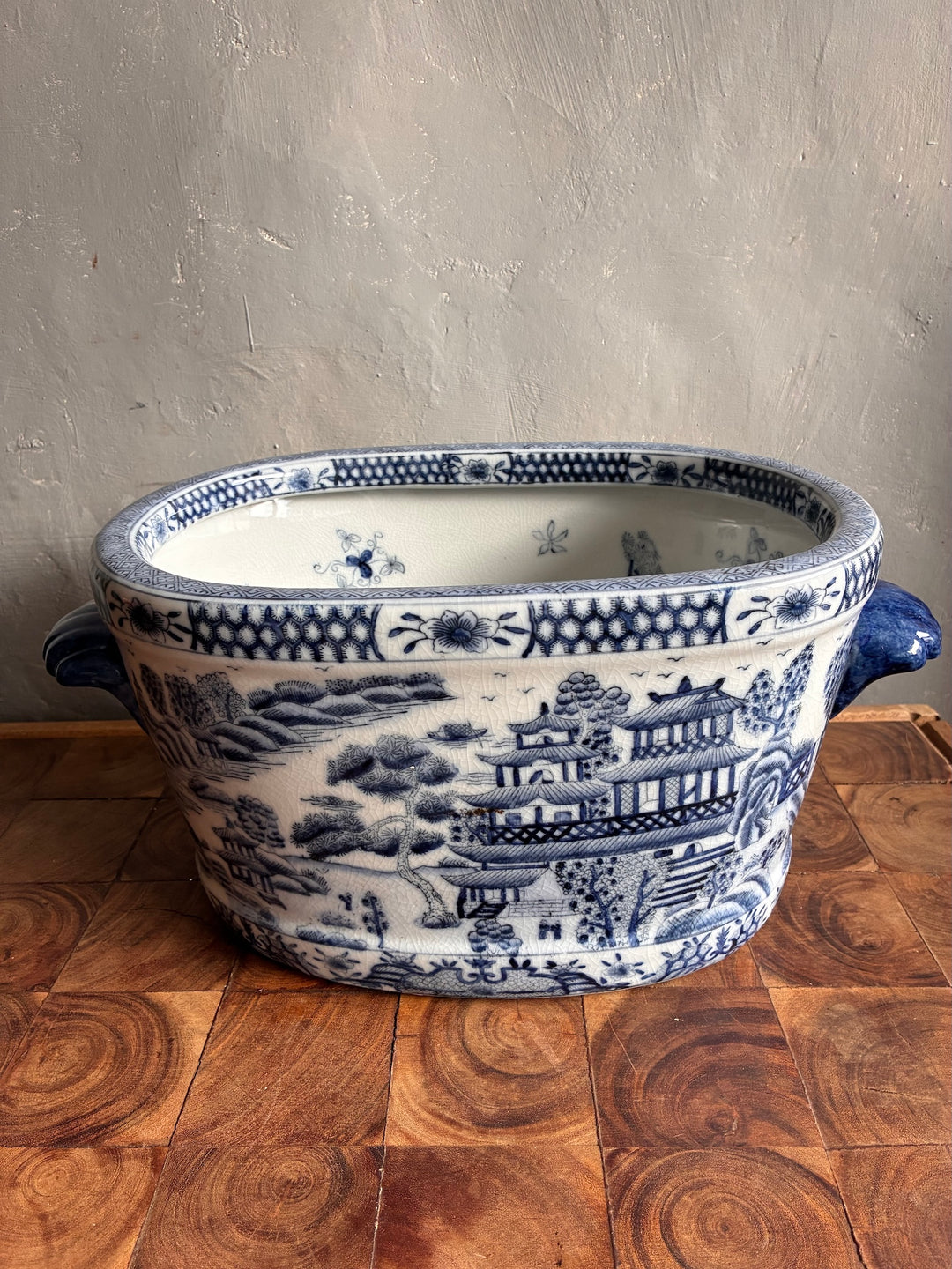 Chinoiserie Blue and White Foot Bath Planter with delicate landscape design, oval shape, and side handles.