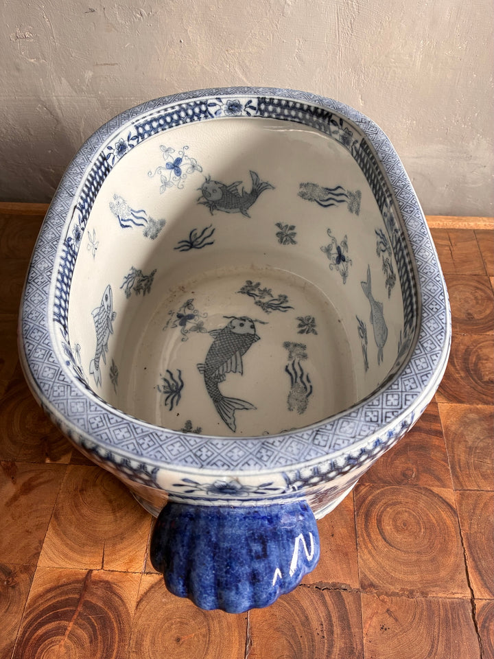 Chinoiserie Blue and White Foot Bath Planter with intricate fish design and decorative patterns inside.