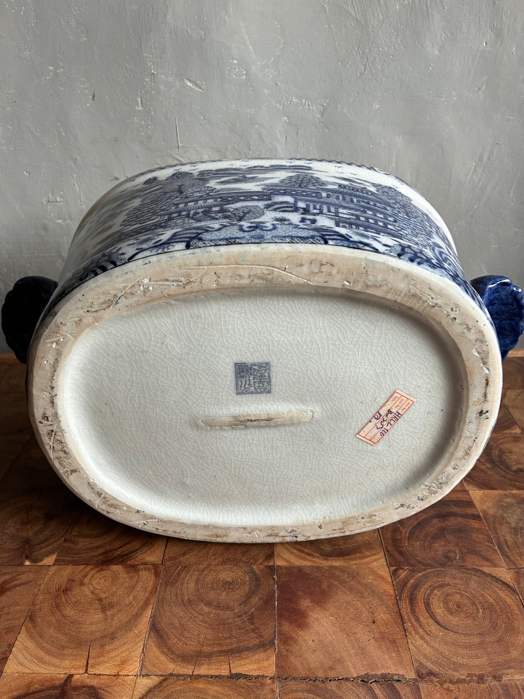 Chinoiserie Blue and White Foot Bath Planter showing the underside, highlighting hand-painted details.
