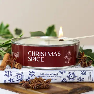 Triple Wick Christmas Spice Pintail Candle with cinnamon and star anise on books, perfect for festive decor from Source for the Goose, Devon.