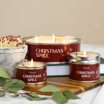 Triple Wick Christmas Spice Pintail Candle from Source for the Goose in festive decor with matches.