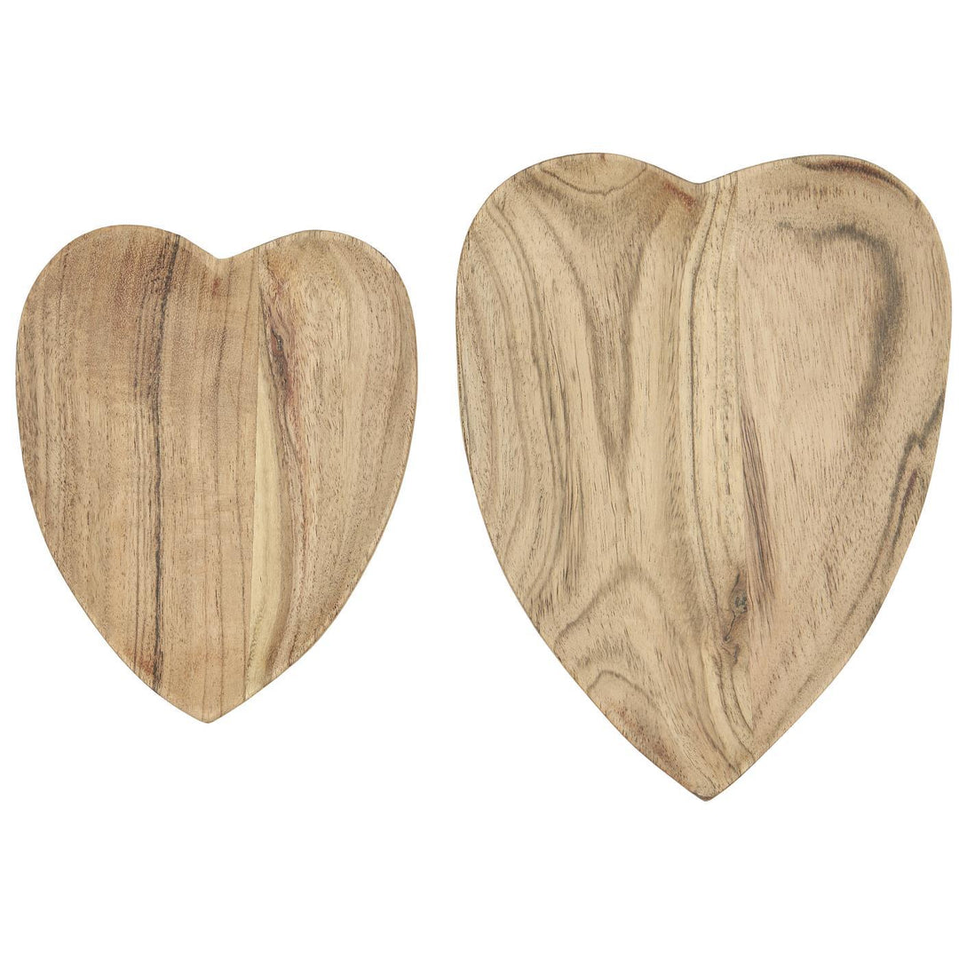 Heart shaped wooden dishes made from Acacia wood, perfect for displaying treats or enhancing home decor.