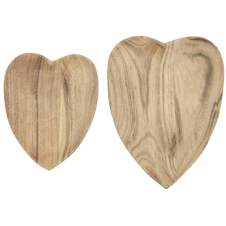 Heart shaped wooden dishes made from Acacia wood, perfect for displaying treats or enhancing home decor.