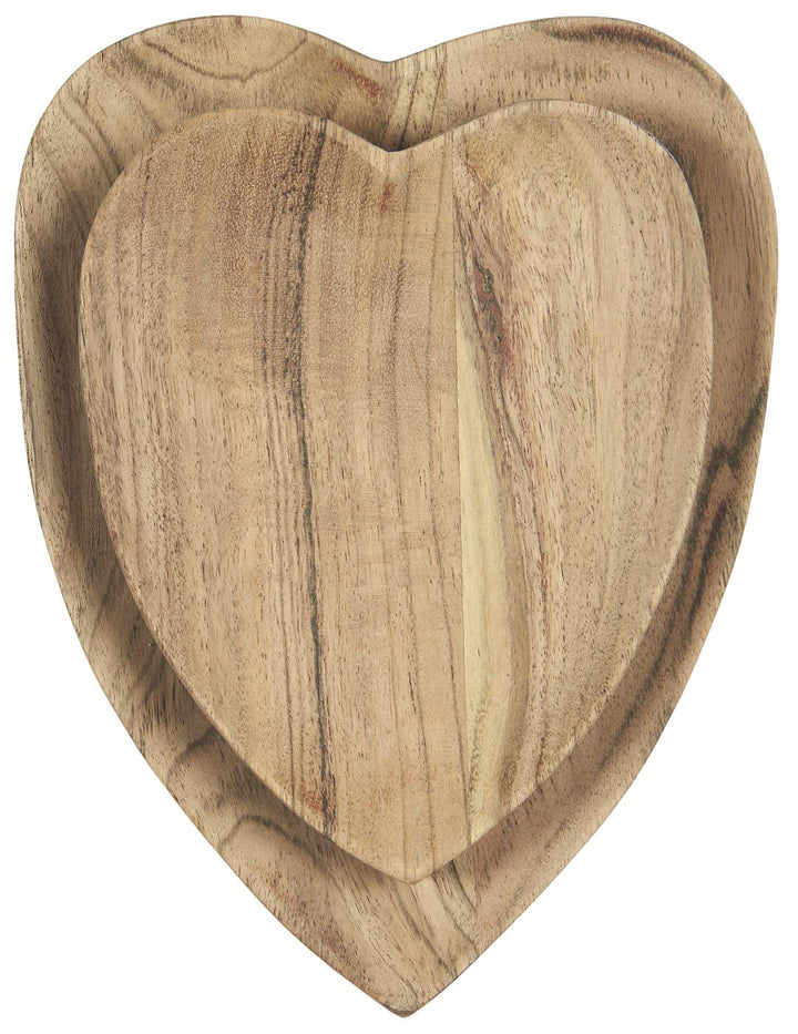 Heart shaped wooden dishes made of acacia wood, perfect for serving snacks. Source for the Goose, Devon.