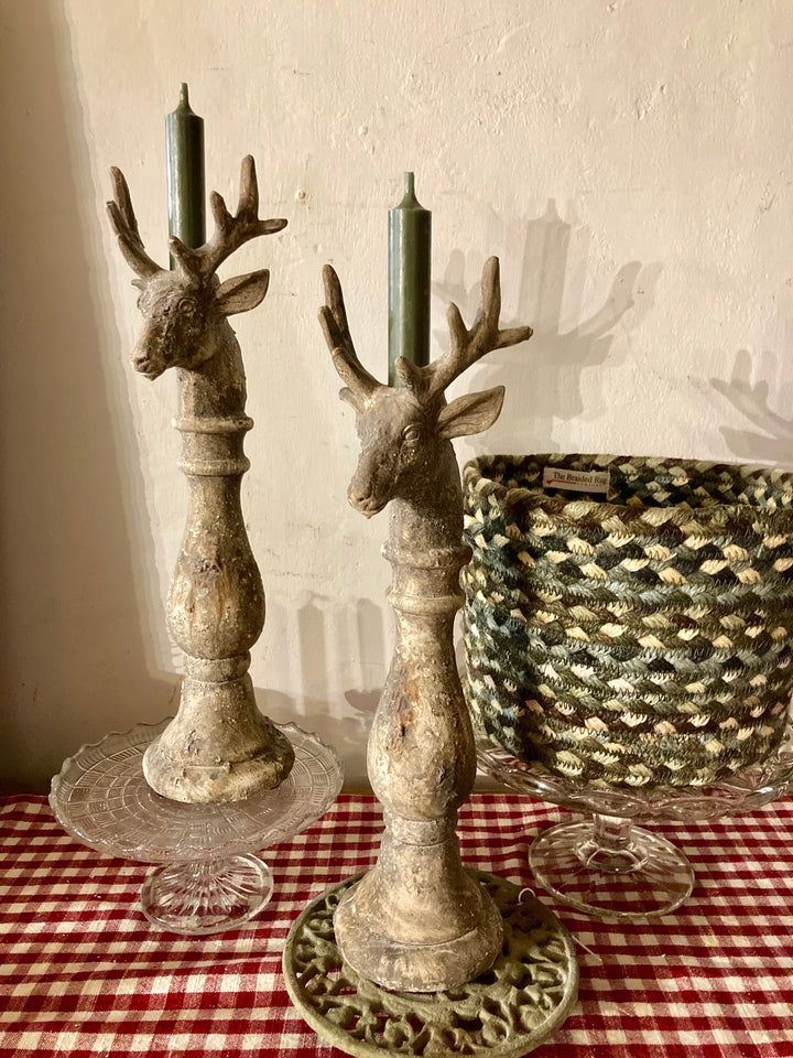 Vintage style deer candleholders with green candles, adding rustic charm to decor, from Source for the Goose, Devon.