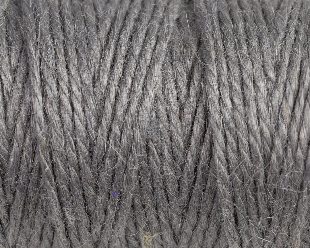 Nutscene Jute Twine on Hanging Recycled Lancashire Mill Bobbin - close-up of gray jute twine texture.