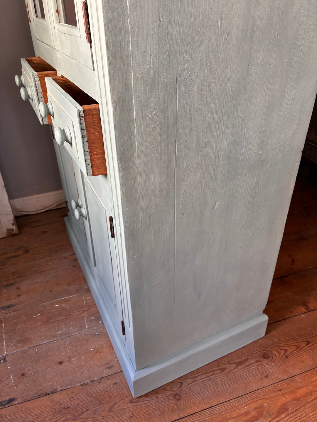 Duck Egg Blue Glazed Kitchen Dresser with drawers and rustic charm on wooden floor.