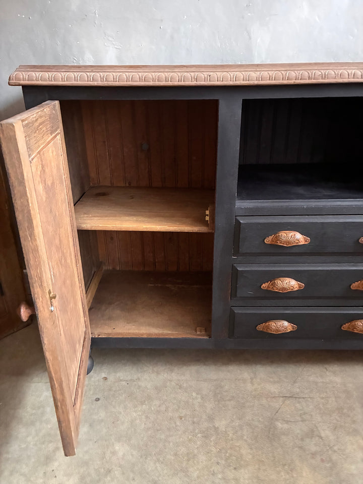 Interior view of Deep Black Oak Sideboard - Hand Painted showcasing spacious shelves and drawers.