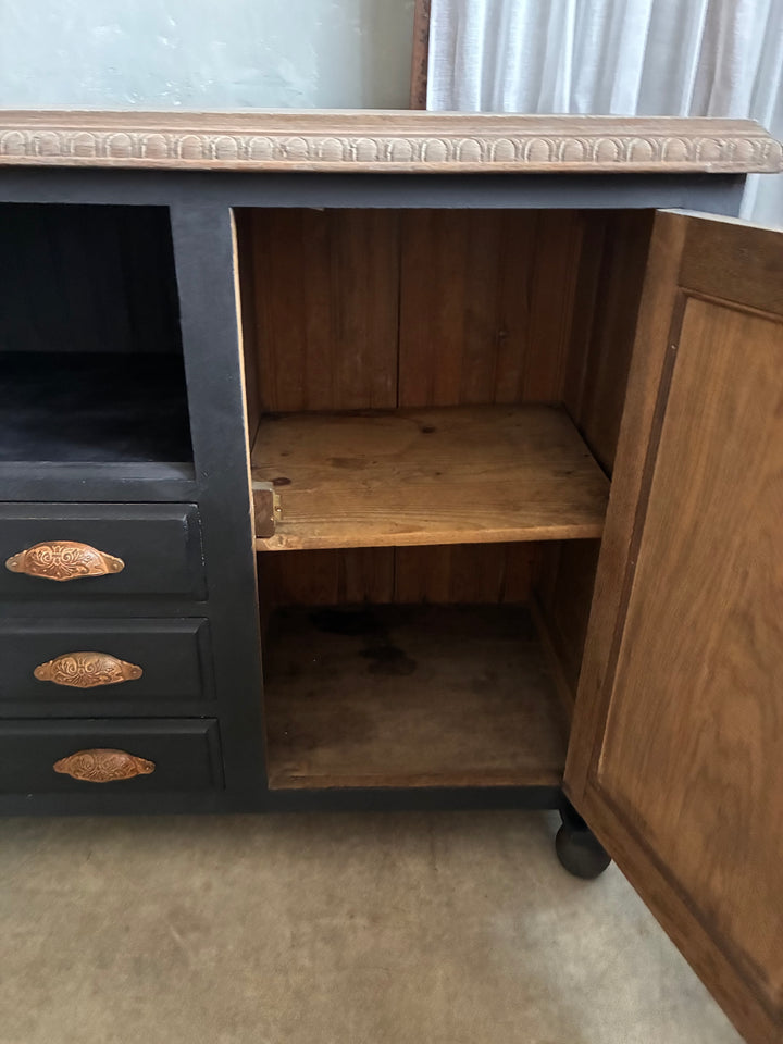 Inside view of the Deep Black Oak Sideboard - Hand Painted showcasing open storage space and drawers.