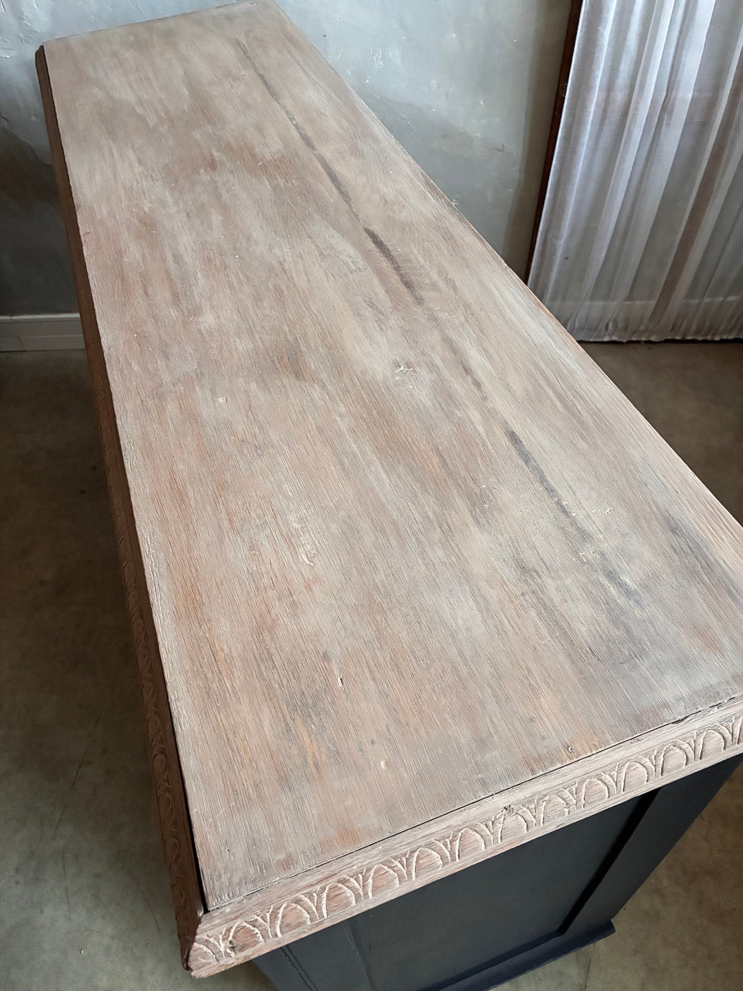 Top view of the Deep Black Oak Sideboard - Hand Painted showcasing the natural grain and carved details.