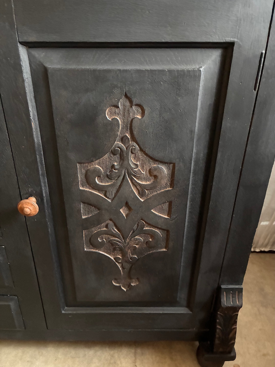 Detailed carving on the Deep Black Oak Sideboard - Hand Painted showcasing intricate design.