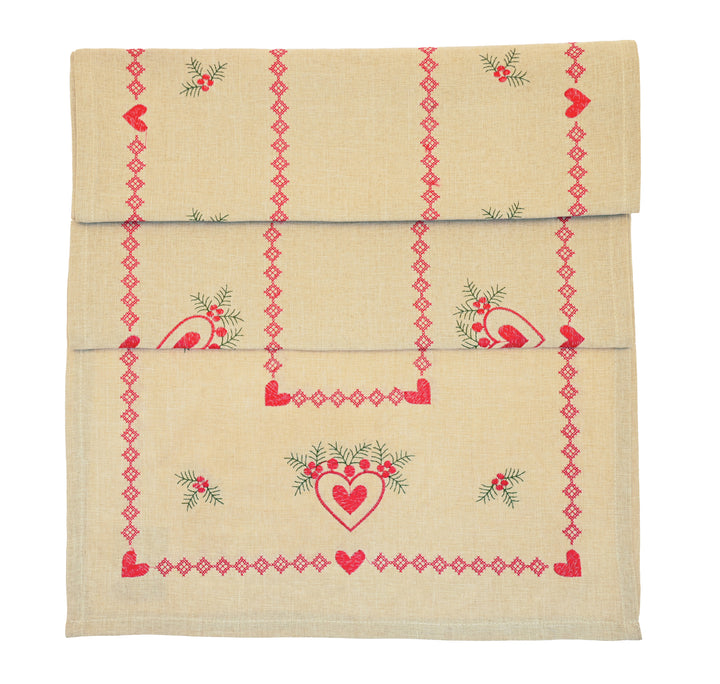 Embroidered Heart and Holly Runner featuring red hearts and holly on a natural linen background for festive styling.