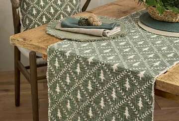 Christmas Tree Trellis Table Runner - Two Colourways displayed on a rustic table with a charming design by Source for the Goose Devon.