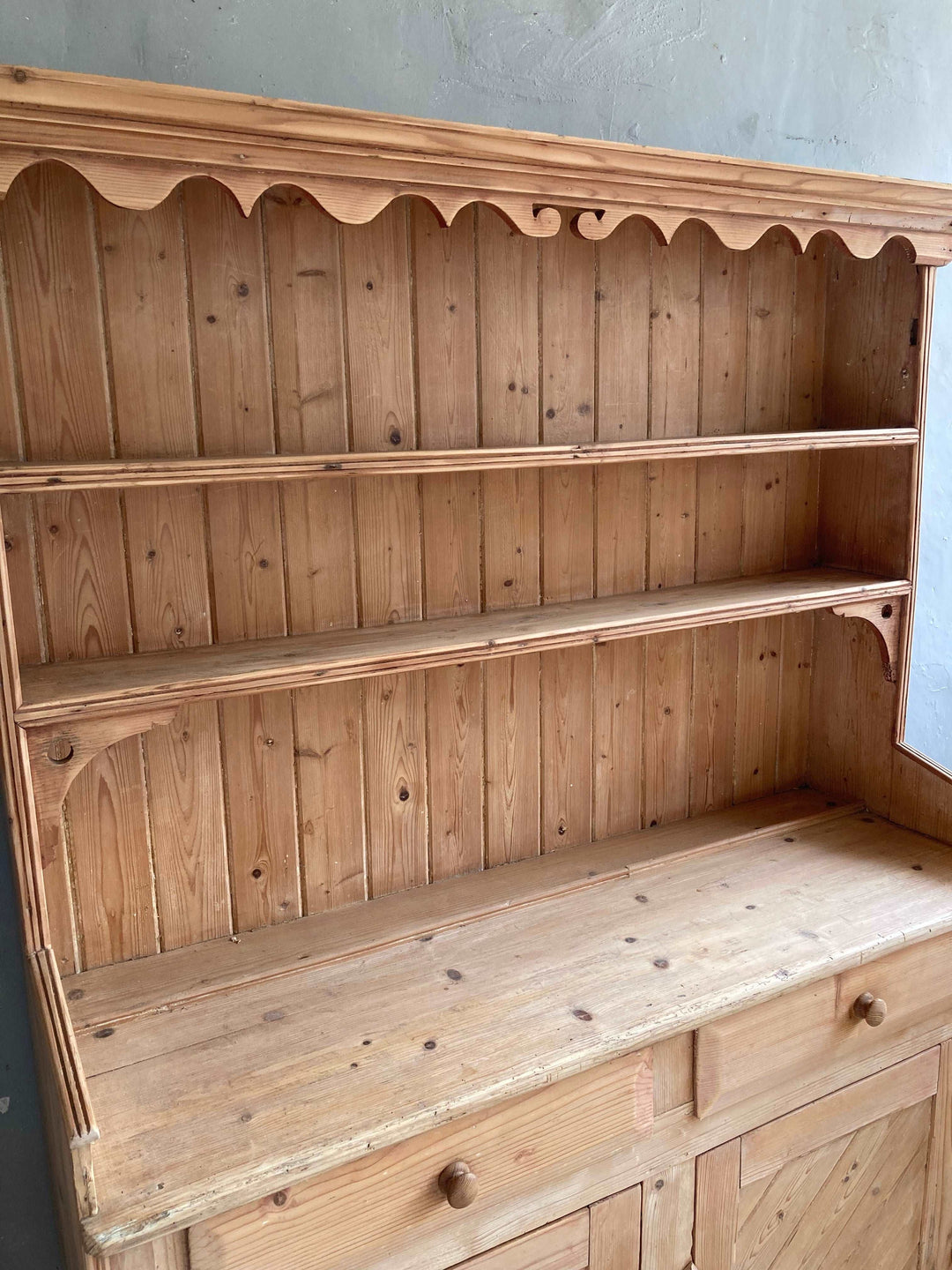plate rack with craved detail on old pine dresser