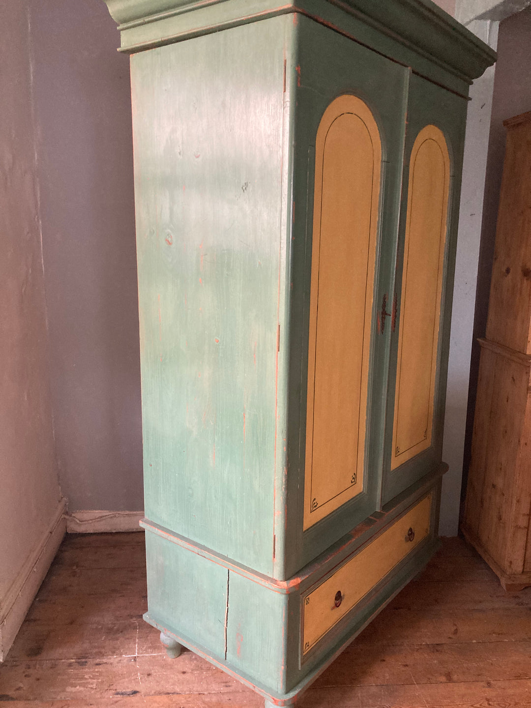 double vintage wardrobe painted in green and yellow