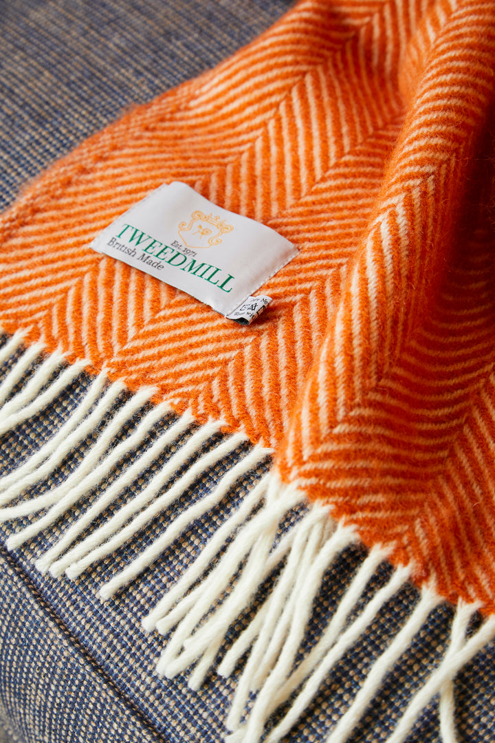 cinnamon orange throw with cream tassels