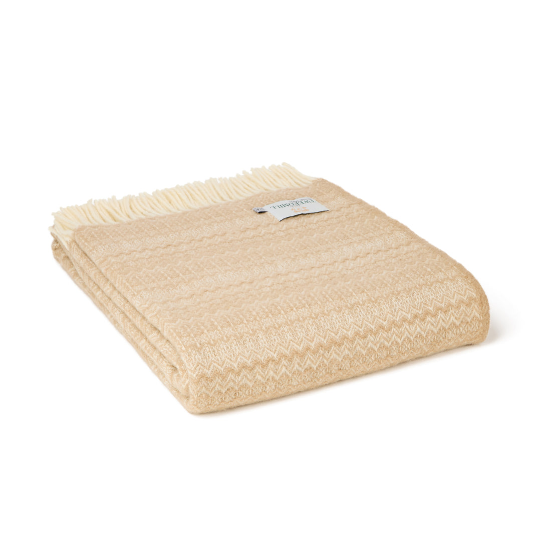 Tweedmill Oatmeal Fair Isle Wool Throw with cream fringe, perfect for draping over furniture or as a cozy blanket.