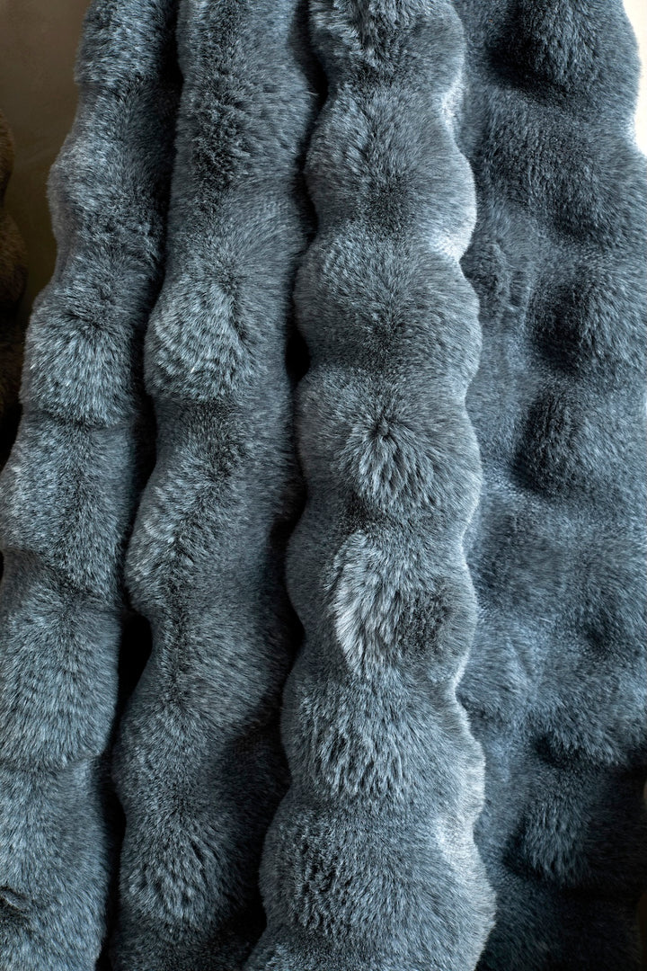 Slate Blue Faux Fur Throw with a luxurious bubble-like texture, perfect for cozy warmth in any setting.