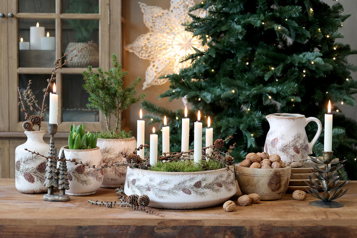 Fir Cone Decorative Planter Bowl displayed with candles and greenery in a cozy winter setting by Source for the Goose, Devon.