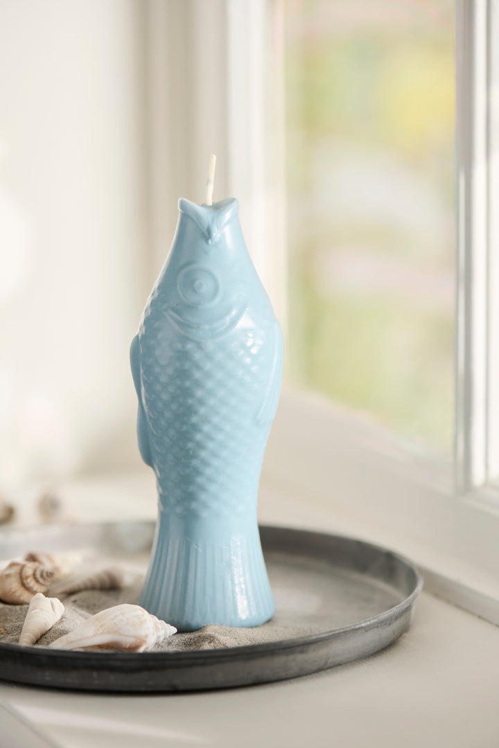 Quirky fish-shaped dusty blue candle by Source for the Goose, adding charm to home décor.