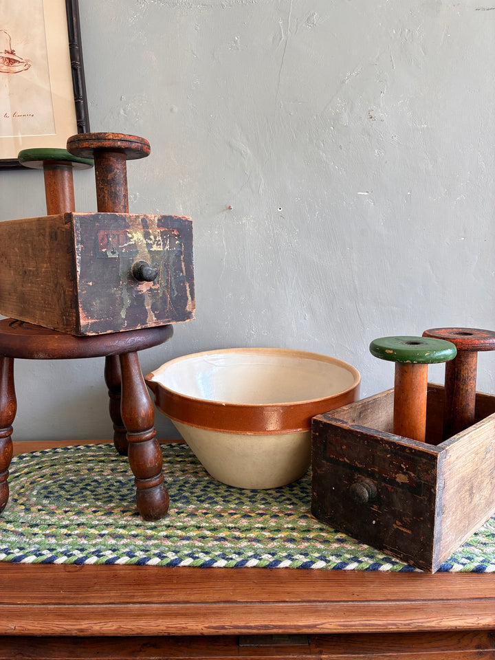 Vintage French Tian Dairy Bowl with antique kitchen tools on a table, perfect for nostalgic decor from Source for the Goose.