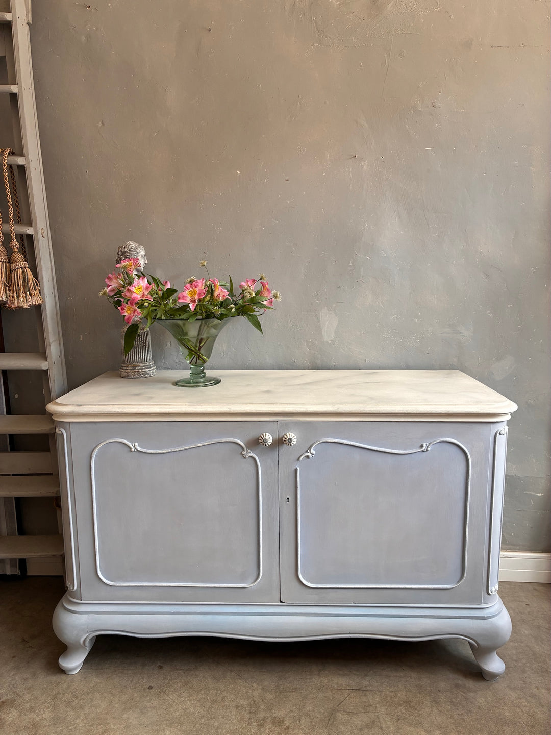 French Style Sideboard - Soft Grey Blue with faux marble top and floral vase decoration.